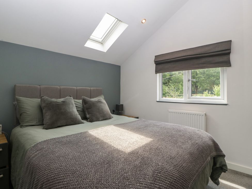 A bedroom with a bed and window at The Annex in 