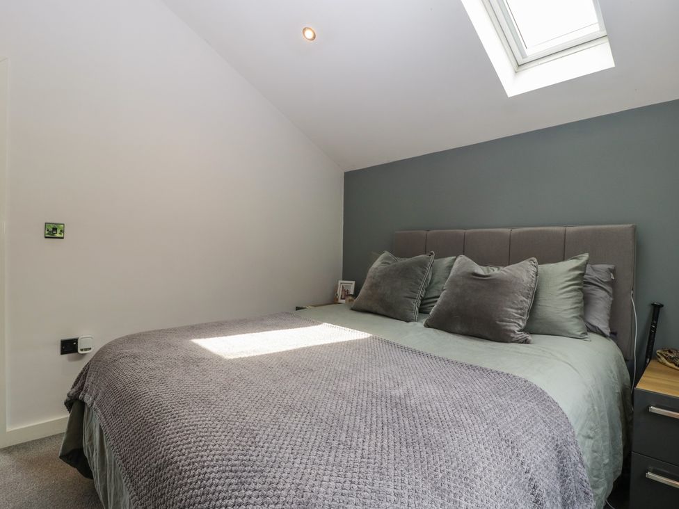 A bedroom with a bed and bedside table at The Annex in 