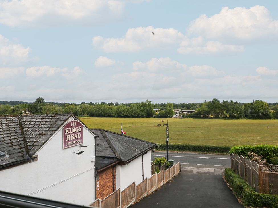 A view of a building and grassy field at The Annex in 