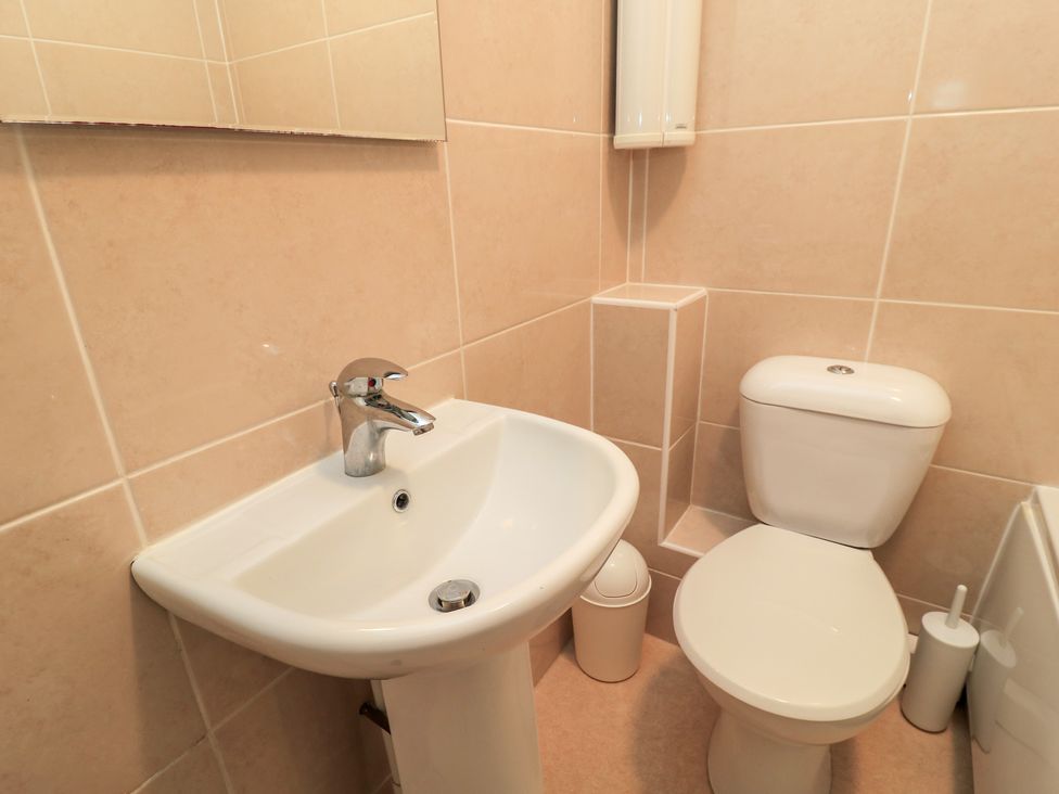 A bathroom with a sink and toilet at Purbeck Vista in Swanage
