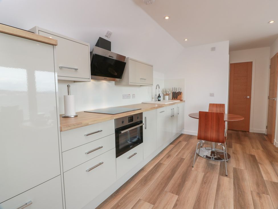 A kitchen with cabinets and appliances at Lazy Bulldog