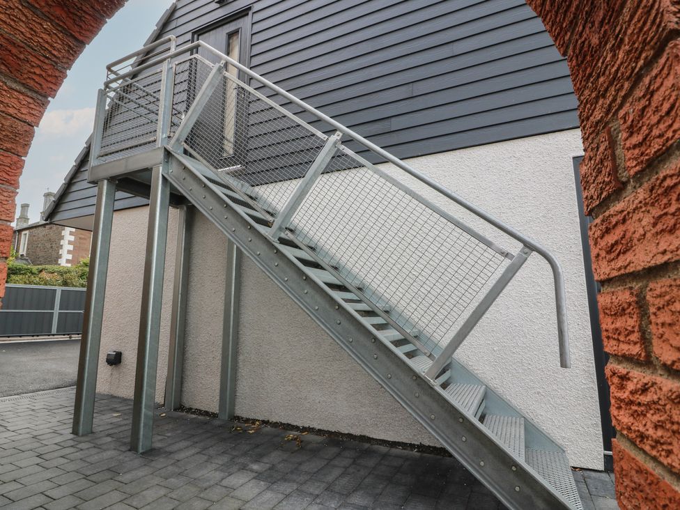 A staircase leading to an upstairs area at Lazy Bulldog in 