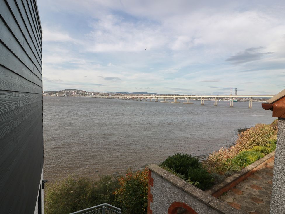 A view of a river and bridge from a building at Lazy Bulldog in 