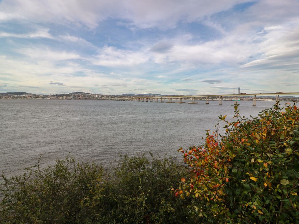 A bridge over water with cityscape in the background at Lazy Bulldog