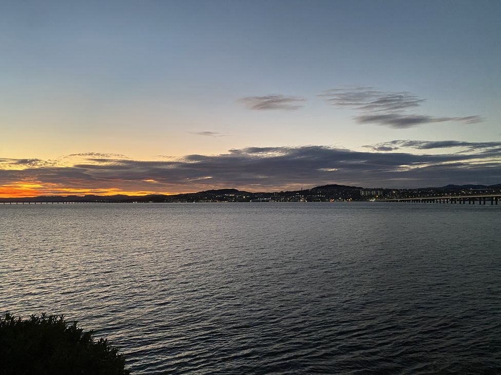 A view of water and mountains at sunset with a bridge at Lazy Bulldog, Newport-On-Tay
