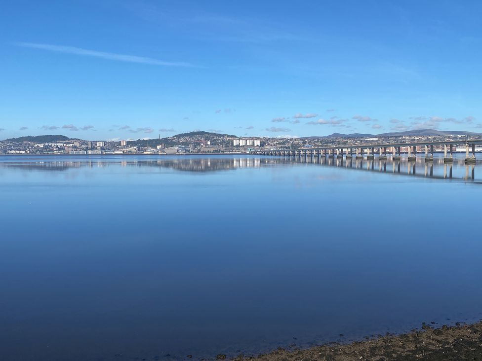 A view of a bridge over water with a cityscape in the background at Lazy Bulldog in Newport-On-Tay