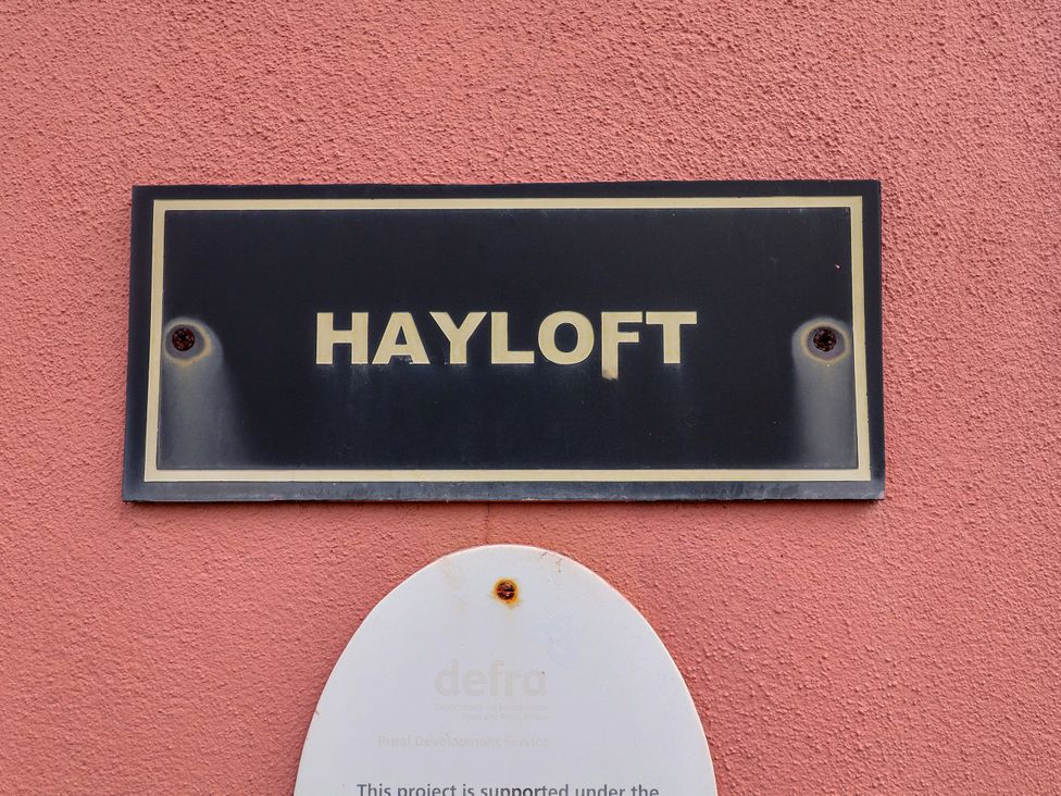 A sign displaying the name Hayloft at Hayloft in Ipswich