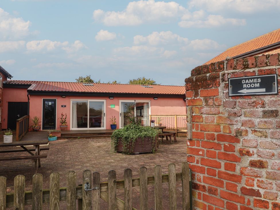 An outdoor games room with seating areas at Fisherman's Rest in Ipswich