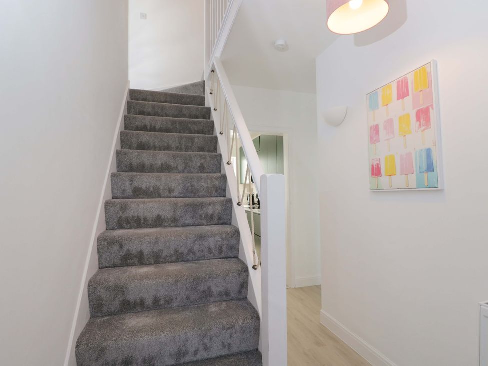 A staircase in a hallway at 6 Newbridge Gardens, Bath