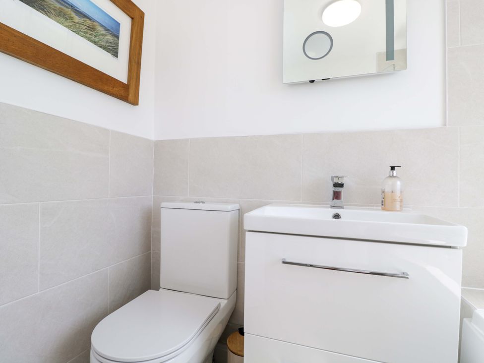 A bathroom with a toilet and sink at 6 Newbridge Gardens in Bath