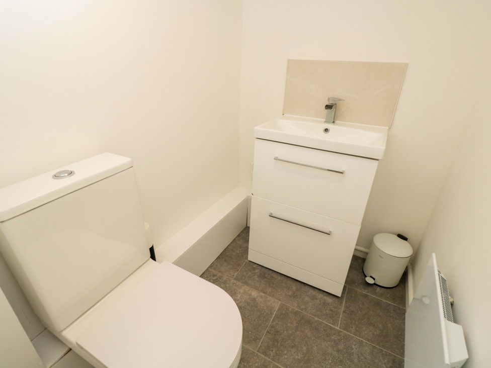 A bathroom with a toilet and sink at 6 Newbridge Gardens in Bath