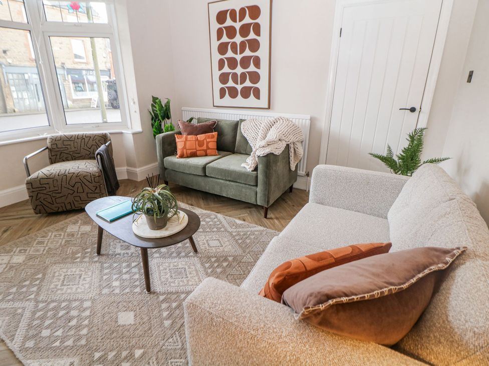 A living room with two sofas and a coffee table at 37 Berry Hill Lane in Mansfield