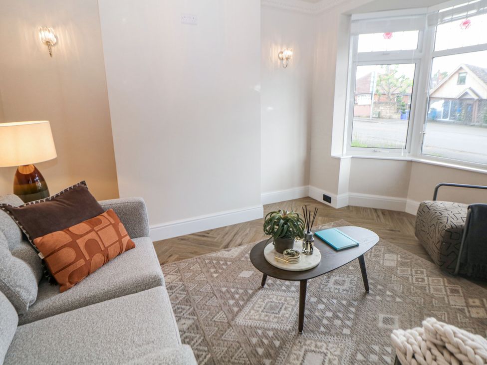 A living room with furniture and decor at 37 Berry Hill Lane in Mansfield