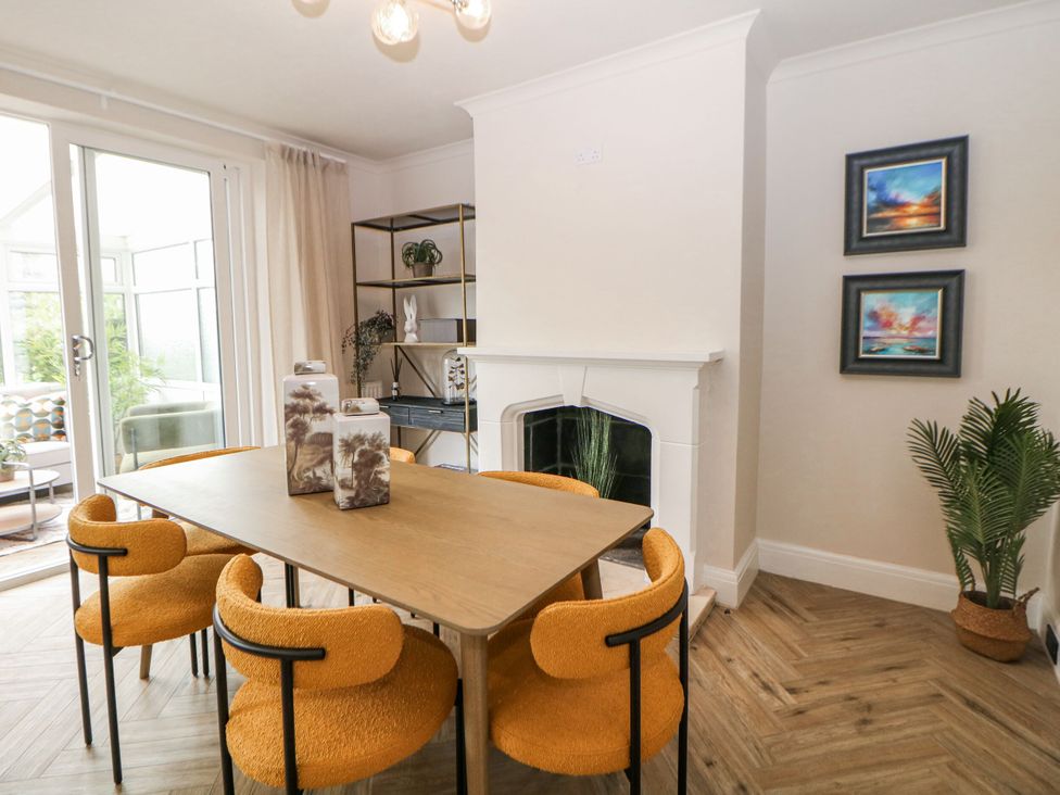A dining room with a table and chairs at 37 Berry Hill Lane Mansfield