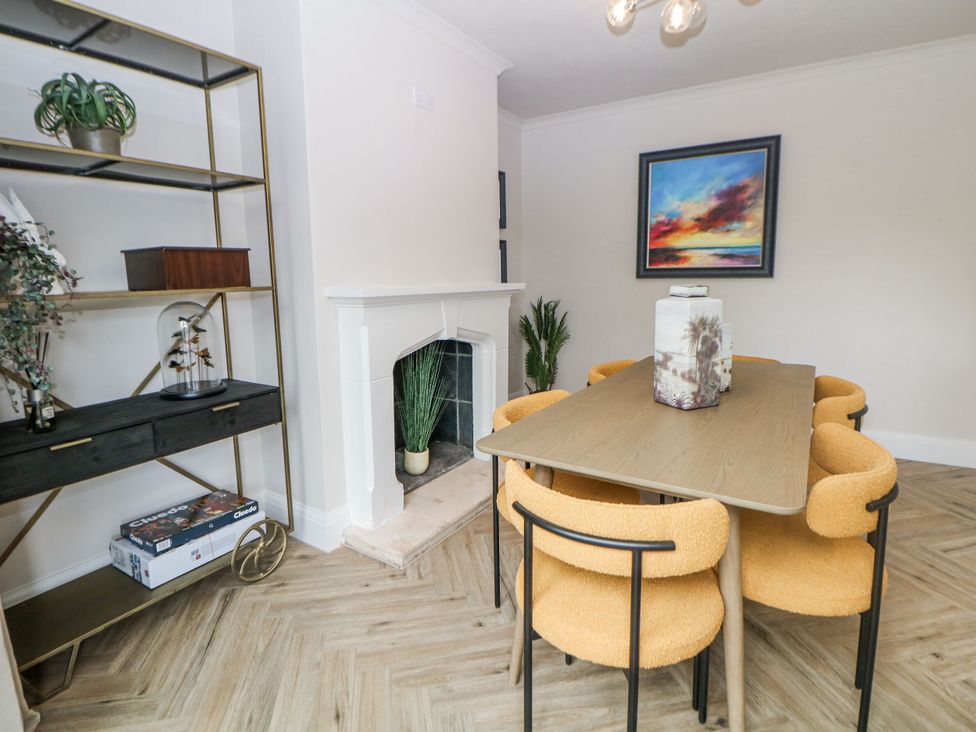 A dining room with a table and chairs at 37 Berry Hill Lane Mansfield