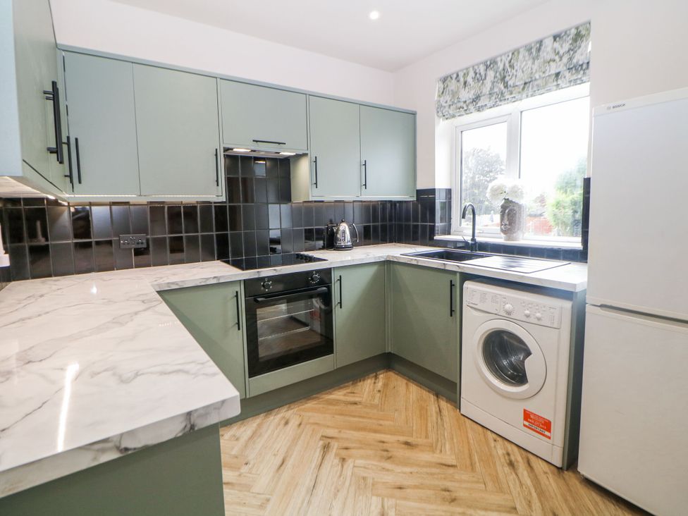 A kitchen with cabinets and countertop at 37 Berry Hill Lane in Mansfield