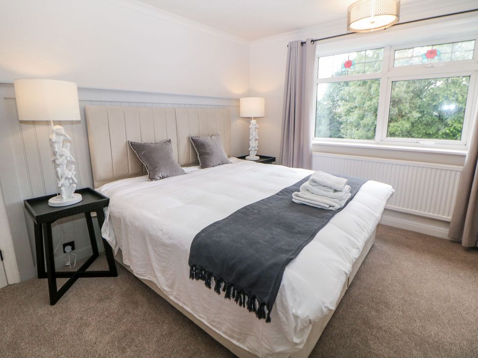 A bedroom with a bed and window at 37 Berry Hill Lane in Mansfield