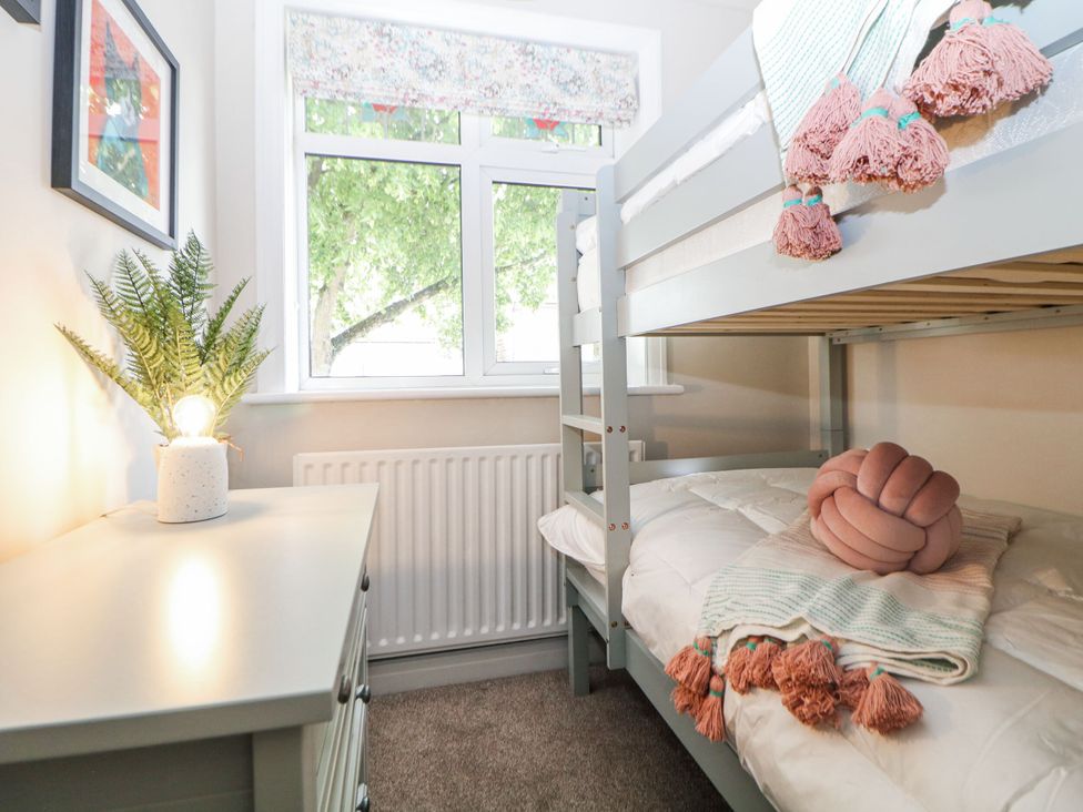 A bedroom with a bunk bed and desk at 37 Berry Hill Lane in Mansfield