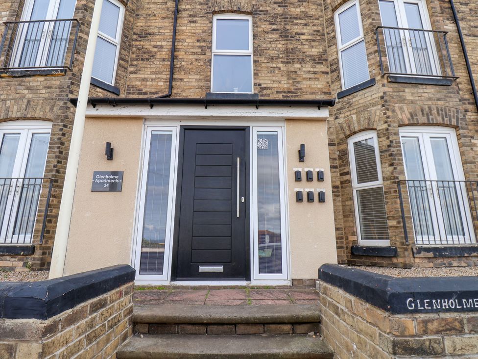 An entrance with mailboxes and a door at Glenholme Apartments in Redcar