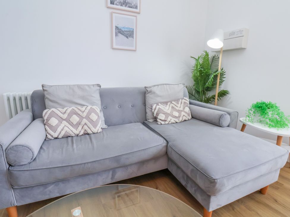 A living room with a sofa and coffee table at Apartment 3 ( 2 bed ) in Redcar