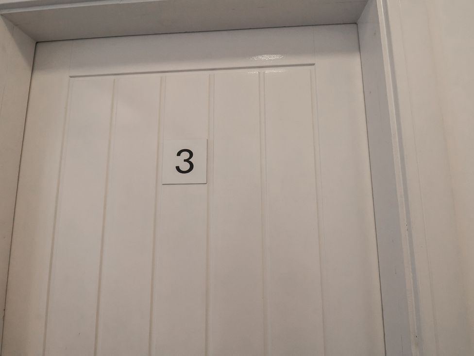 A white door with the number 3 at Glenholme Apartment 3 Redcar