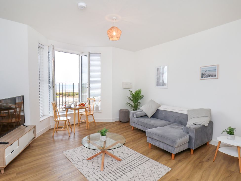 A living room with a sofa and coffee table at Apartment 4 (1 bed) in Redcar