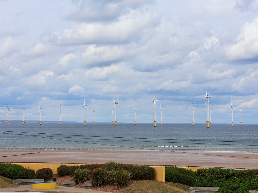 Wind turbines installed in the sea near the beach at Apartment 4 ( 1 bed ) in Redcar