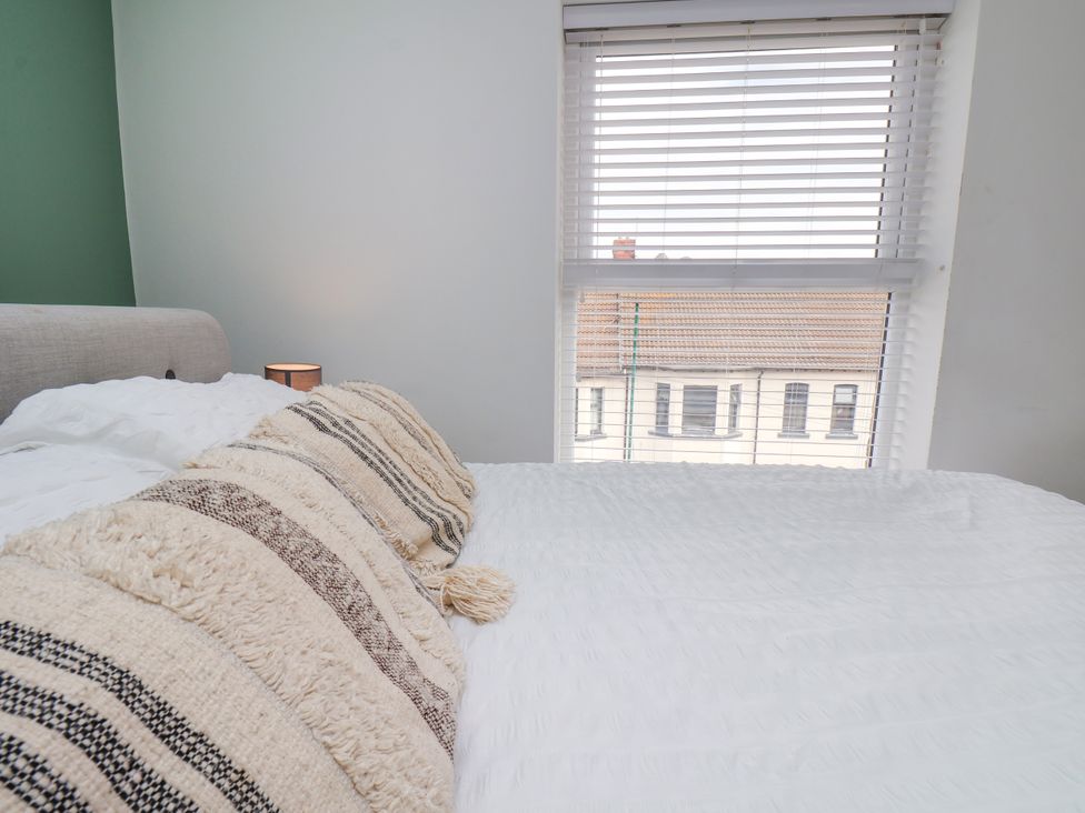 A bedroom with a bed and window view at Apartment 5 ( 1 bed ) in Redcar