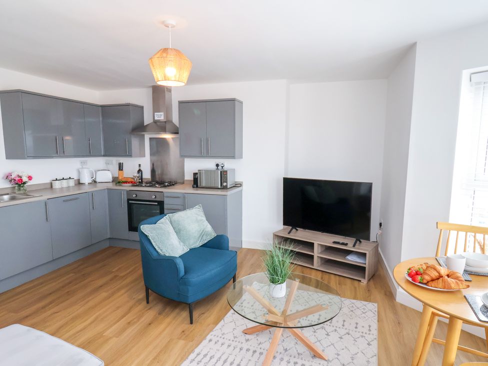 A living room with a kitchen and dining area at Apartment 6 (1 bed) Redcar