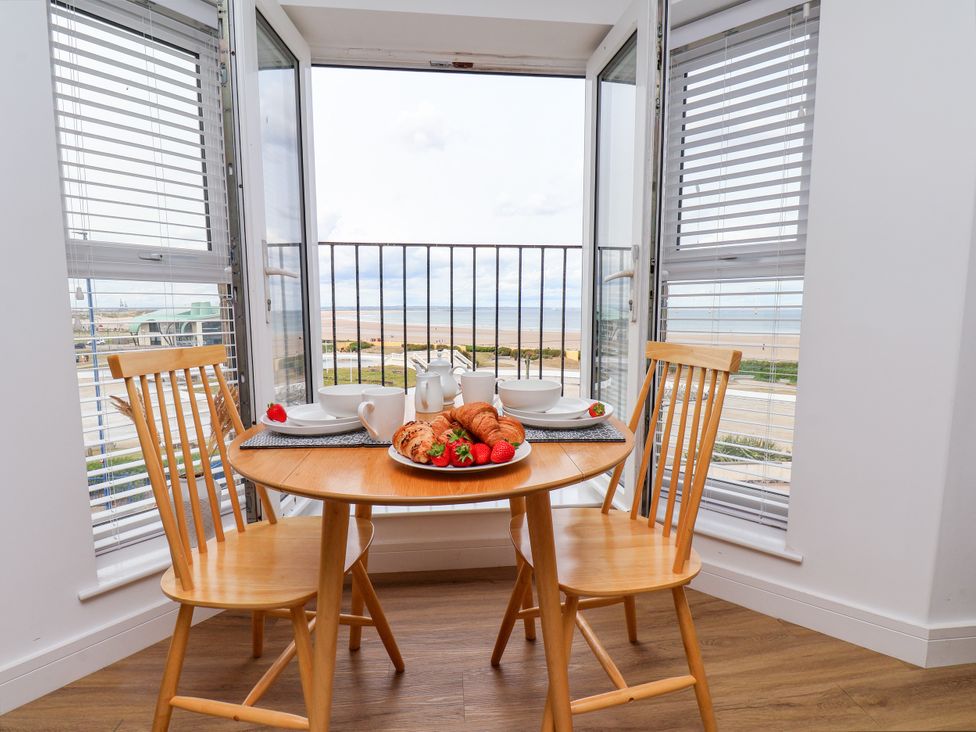 A dining area with a table set for breakfast at Apartment 6 (1 bed) Redcar