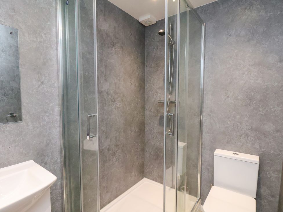 A bathroom with a shower, toilet and sink at Apartment 6 (1 bed) in Redcar