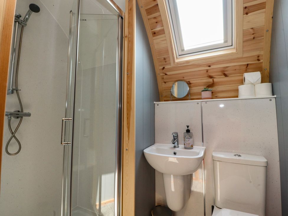 A bathroom with a shower and sink at Barley near Nelson