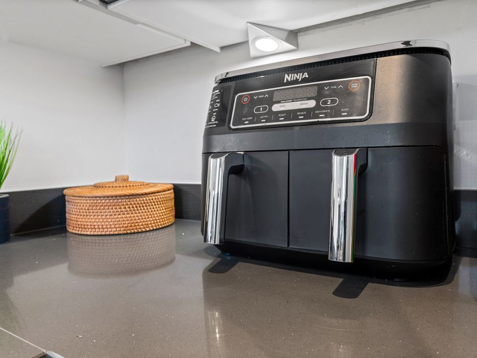 A Ninja air fryer on a countertop at Hafan Rhos in Rhos-On-Sea