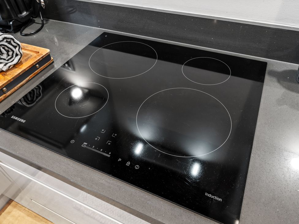 An induction cooktop on a kitchen countertop at Hafan Rhos, Rhos-On-Sea