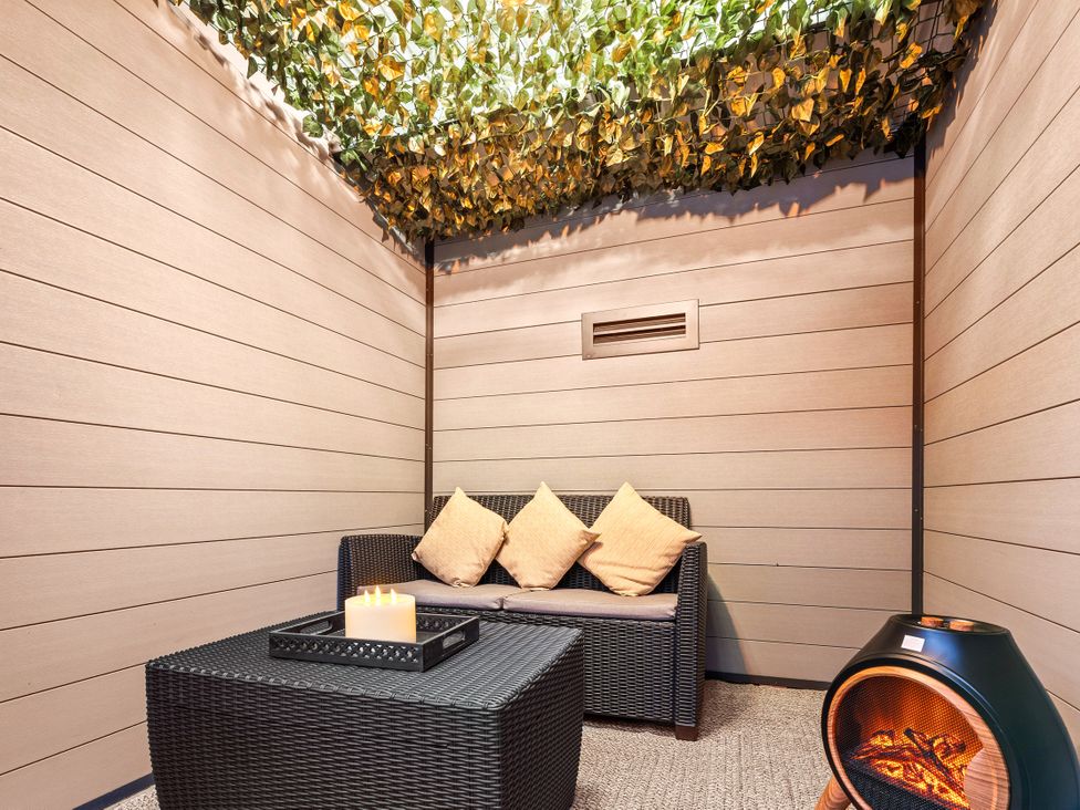 A lounge area with a sofa and coffee table at Hafan Rhos in Rhos-On-Sea