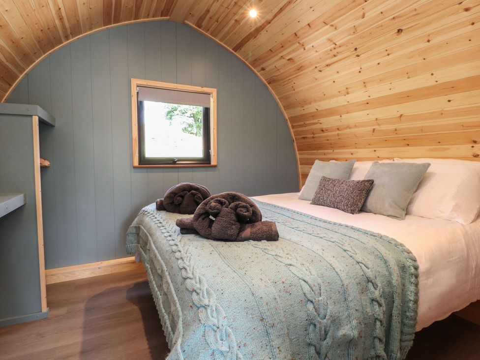 A bedroom with a bed and shelf at Ogden in Nelson