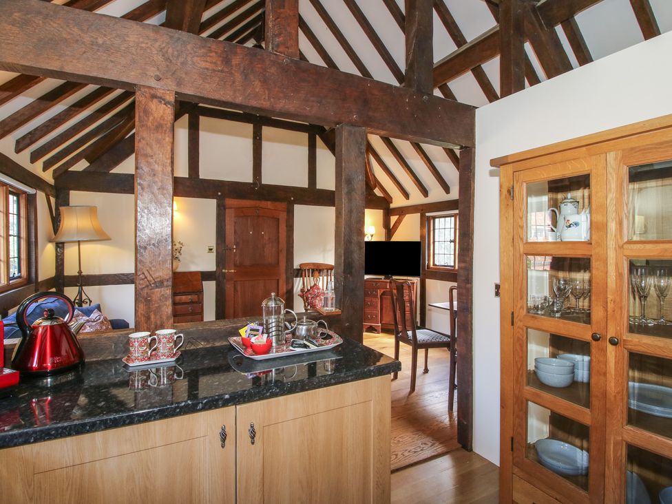 A kitchen with a kettle and cups on the counter at The Coach House in Little Stretton