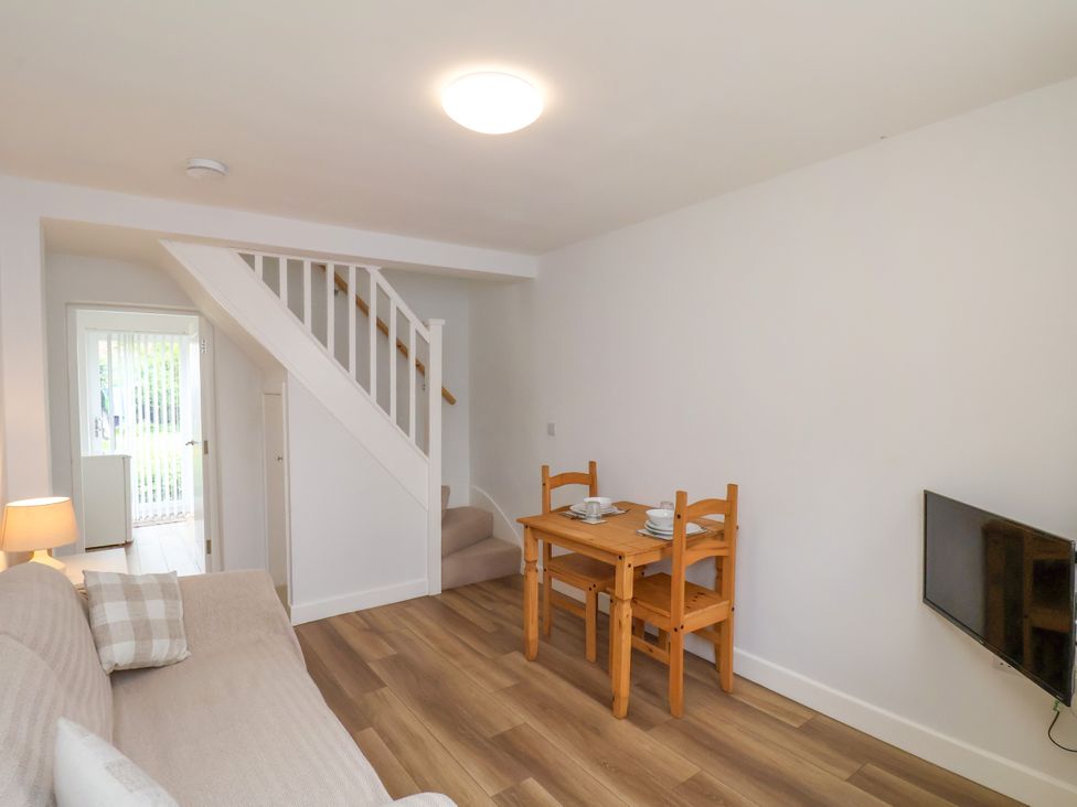 A living room with a sofa and dining table at 94 Church Street in Guisborough