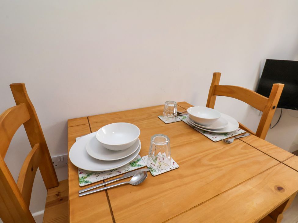 A dining room table set with plates and glasses at 94 Church Street Guisborough