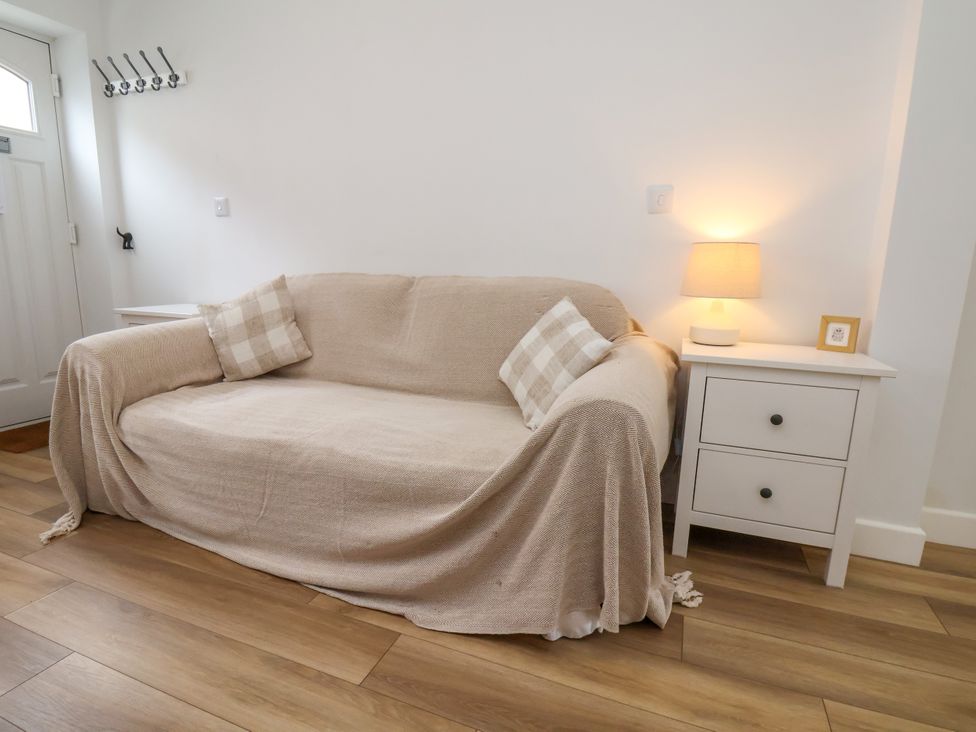 A living room featuring a sofa and side table at 94 Church Street, Guisborough