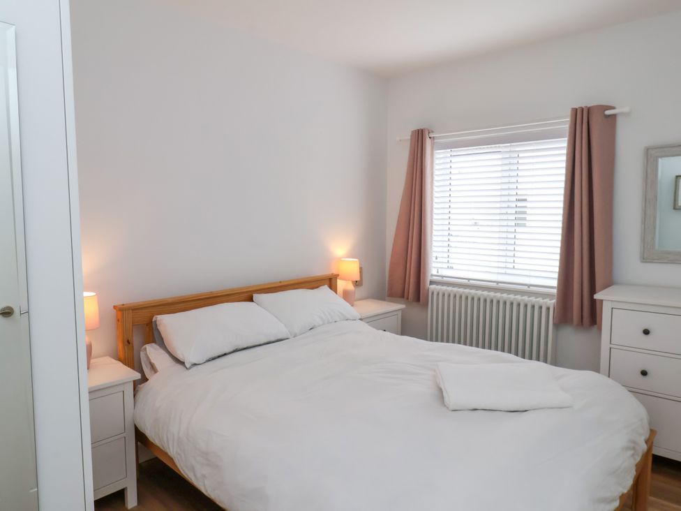 A bedroom with a bed and nightstand at 94 Church Street in Guisborough