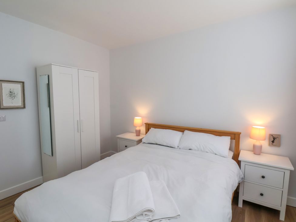 A bedroom with a bed and wardrobe at 94 Church Street in Guisborough