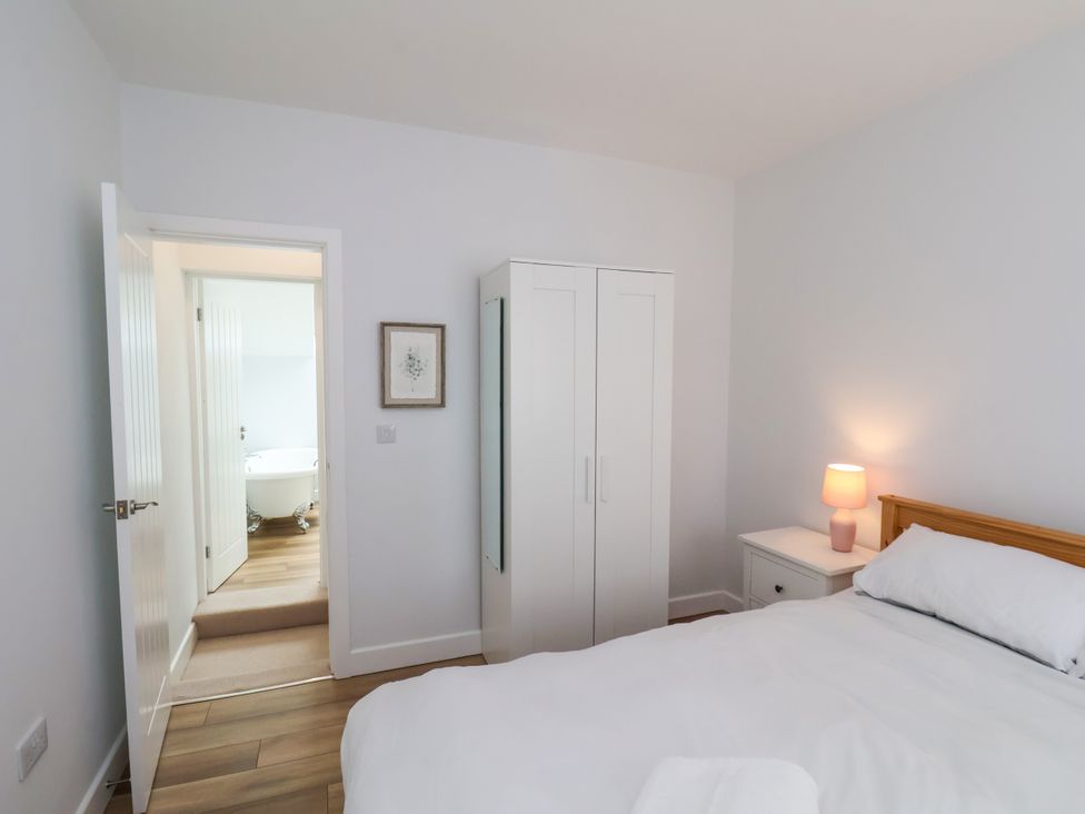 A bedroom featuring a bed and wardrobe at 94 Church Street in Guisborough