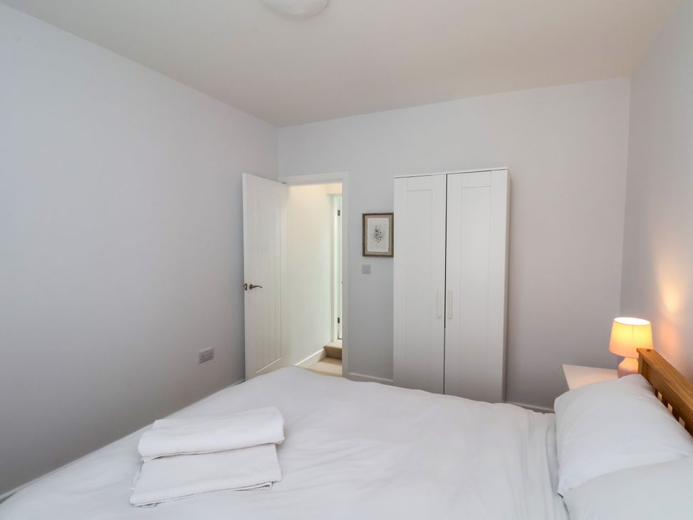 A bedroom with a bed and wardrobe at 94 Church Street in Guisborough