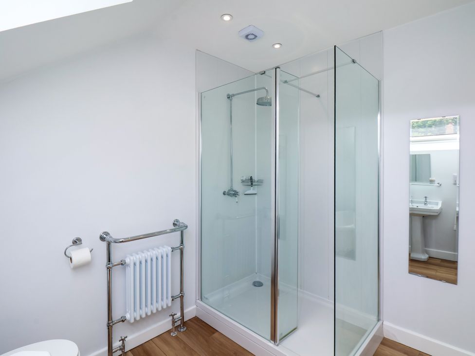 A bathroom with a shower and sink at 94 Church Street in Guisborough