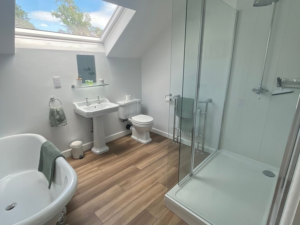 A bathroom with a bathtub and shower at 94 Church Street in Guisborough