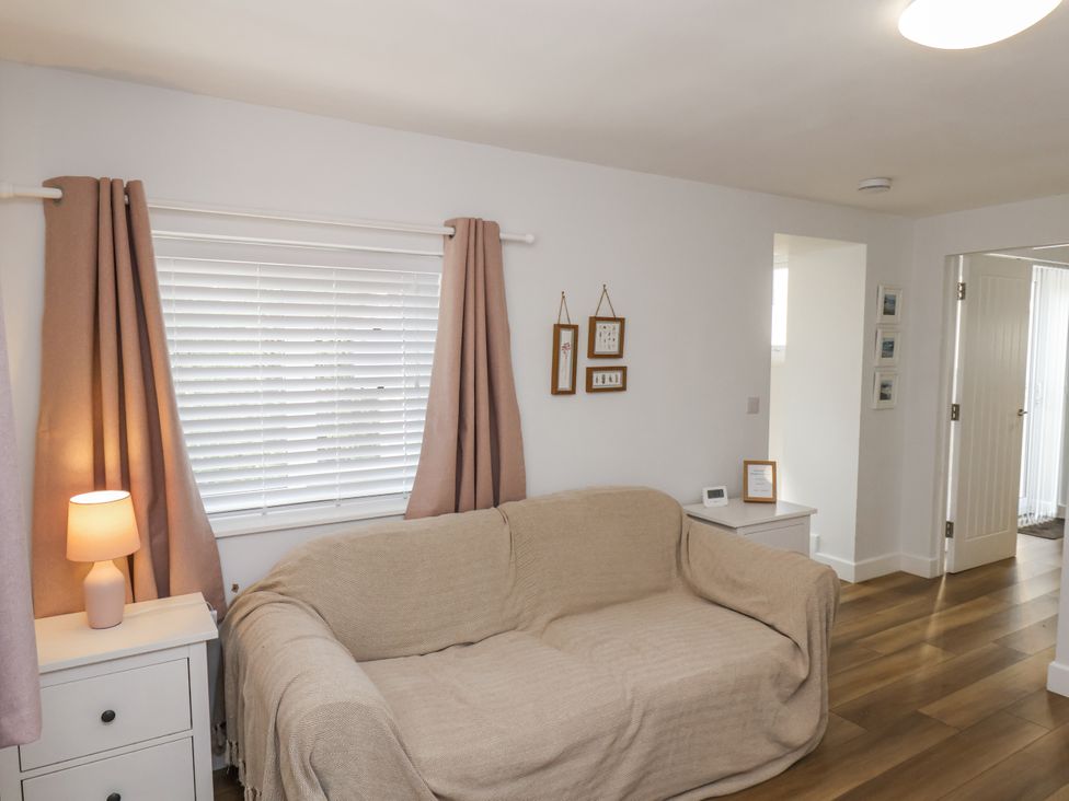 A living room with a sofa and lamp at 96 Church Street in Guisborough