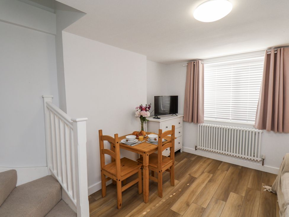 A dining room with a table and chairs at 96 Church Street in Guisborough