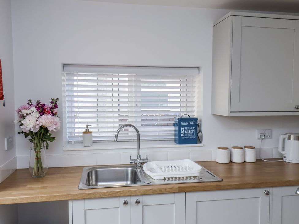A kitchen with a sink and flower vase at 96 Church Street in Guisborough