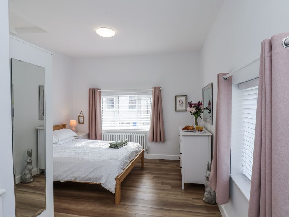 A bedroom with a bed and dresser at 96 Church Street in Guisborough